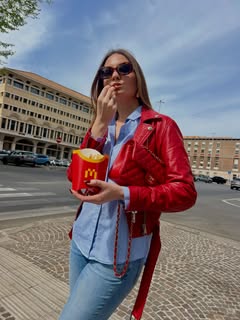 May be an image of french fries, cigarette and text