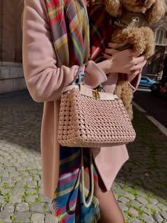 May be an image of scarf, purse, fur and text