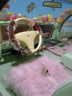 May be an image of rearview mirror, convertible, palm trees and text