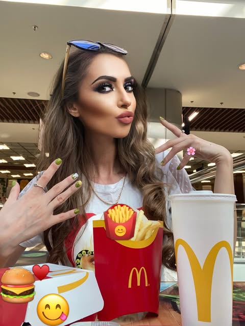 May be an image of one or more people, makeup, burger, french fries and text that says 'M Y'