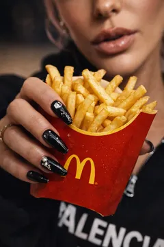 May be an image of one or more people, fingernails, makeup, french fries and text