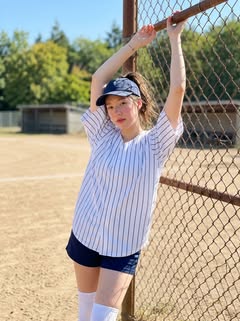 May be an image of tennis, baseball, softball, sportswear, fishnet stockings, headscarf and text