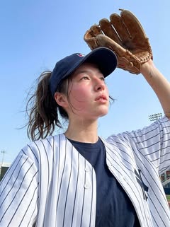 May be an image of softball, batting, pitcher and text