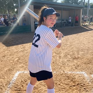 May be an image of batting, softball and text