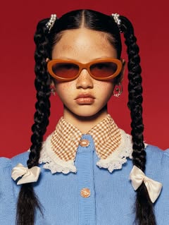 May be an image of one or more people, braids, makeup, glasses and text