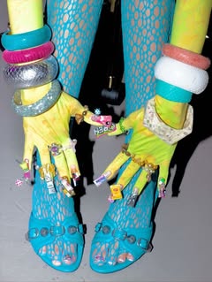 May be an image of fishnet stockings, bangle and text