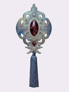 May be an image of brooch, tassel and text