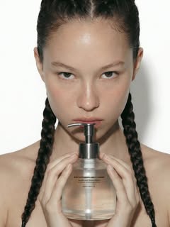 May be an image of one or more people, braids, makeup, fragrance, perfume, bottle, hand cream and text