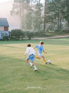 May be an image of child, football, soccer, grass and text