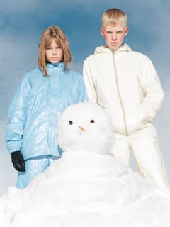 May be an image of child, raincoat, snowsuit, parka, snowman, turtleneck, snow and text