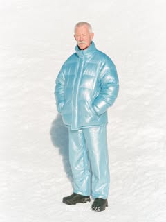 May be an image of goosedown coat, fur coat, sportswear, raincoat, snowsuit, turtleneck, parka, ski and text