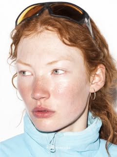 May be an image of one or more people, makeup, turtleneck, glasses and text