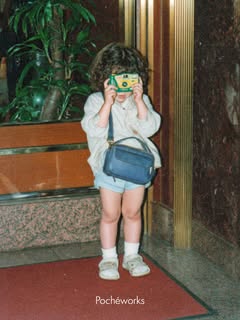 May be an image of child, bandage, telephone, portable cassette player, eye patch, binoculars, miniskirt, camera and text