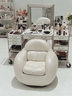 May be an image of one or more people, makeup, cosmetics, chair, chaise lounge, indoors and text