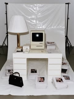 May be an image of telephone, desk, computer and text