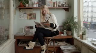 May be an image of turtleneck, boots and text