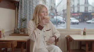 May be an image of smoking, bath robe and text