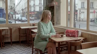 May be an image of one or more people, cardigan and text