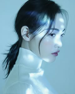 May be an image of one or more people, makeup, hair, turtleneck and text