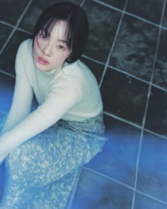 May be an image of one or more people, hair, makeup, turtleneck and text
