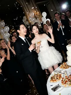 May be an image of wedding cake, sparkler, wedding and text